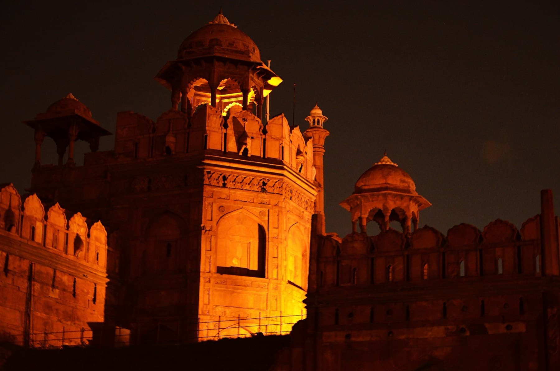 A heritage fort lit for an evening event